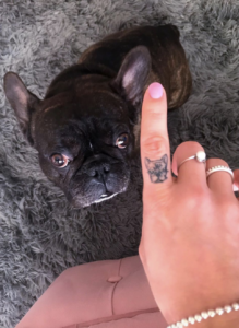 Finger french bulldog tattoo with black french bulldog standing next to it